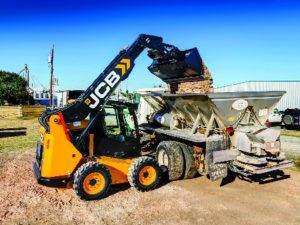 Teleskid loading dirt into a truck