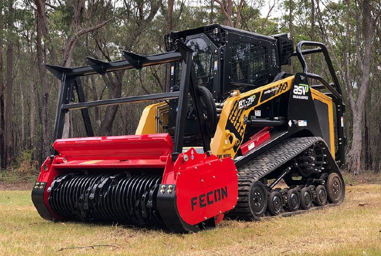 Fecon Bull Hog mulching attachment mounted on a tracked skid steer for land clearing and vegetation management